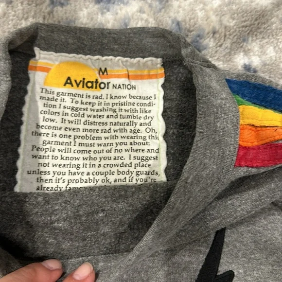 Aviator nation grey with rainbow stripes down sleeves and small black bolt